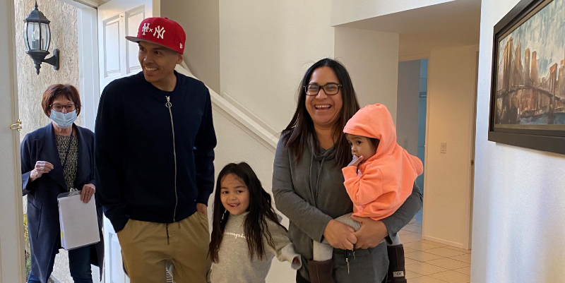 Lance Corporal Bonet with his wife and two daughters in their new home
